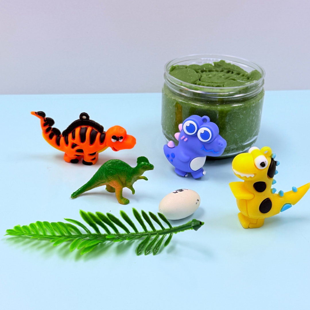 Set of colorful dinosaur figurines with a small jar