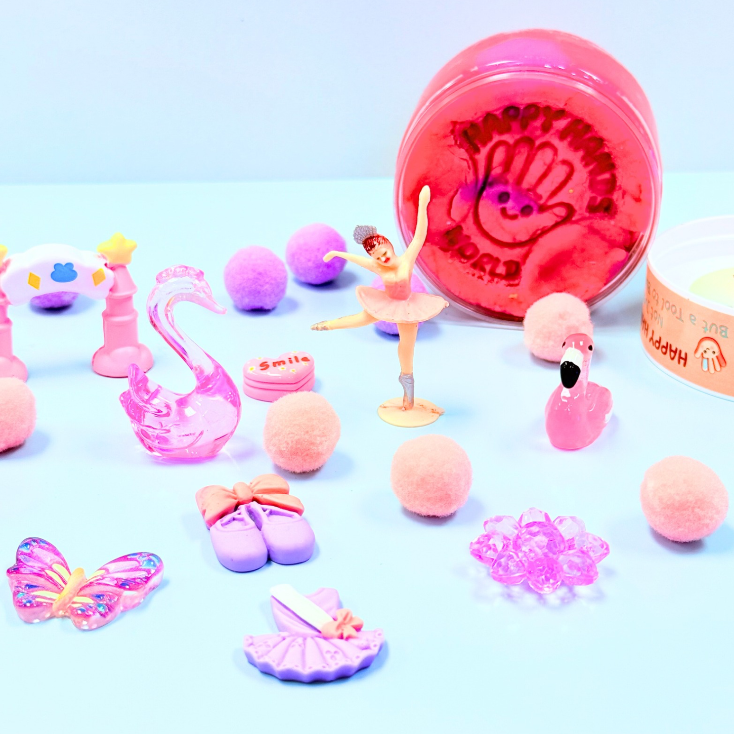 Collection of small pink toys and figurines
