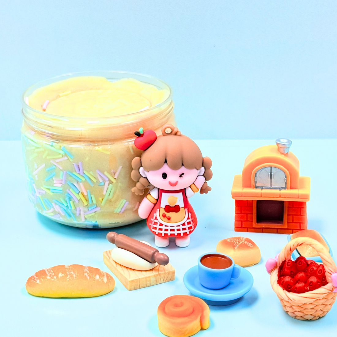 Set of toy baking items including a jar, figurine