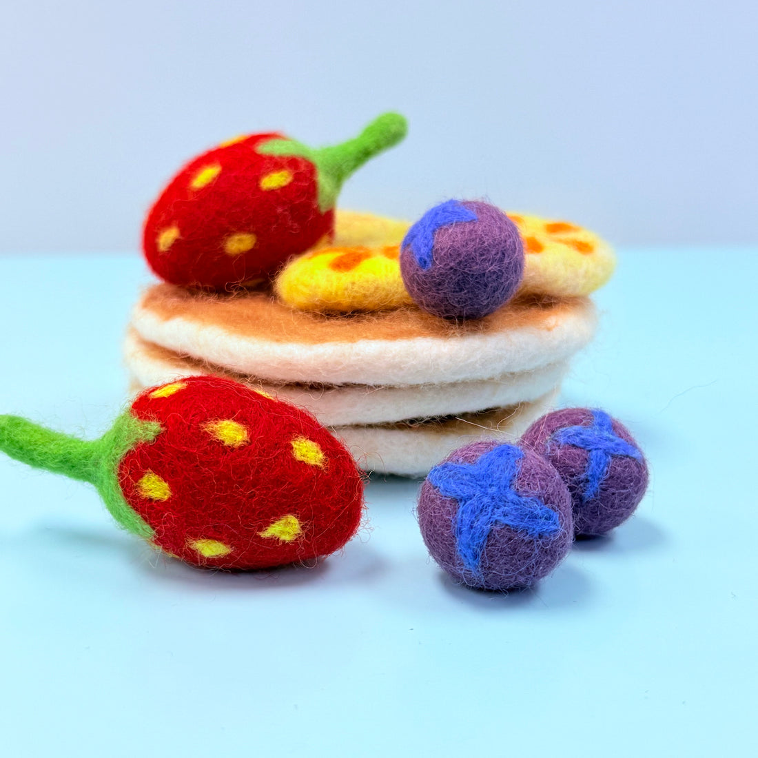 Felted toy set with strawberries, pizza, and balls