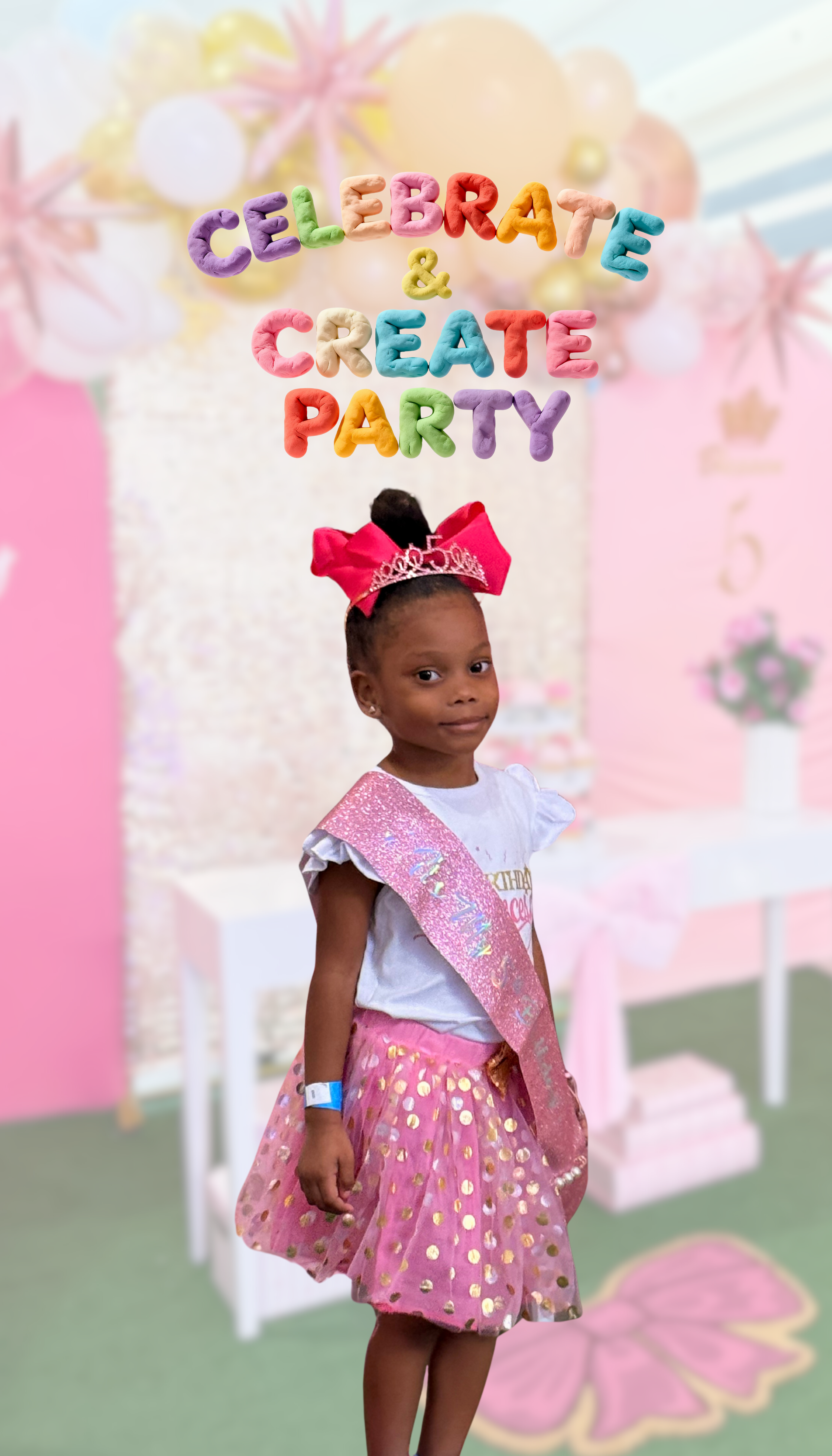 Young girl in a pink party outfit with a tiara and sash, standing in front of a 'Celebrate & Create Party' backdrop.