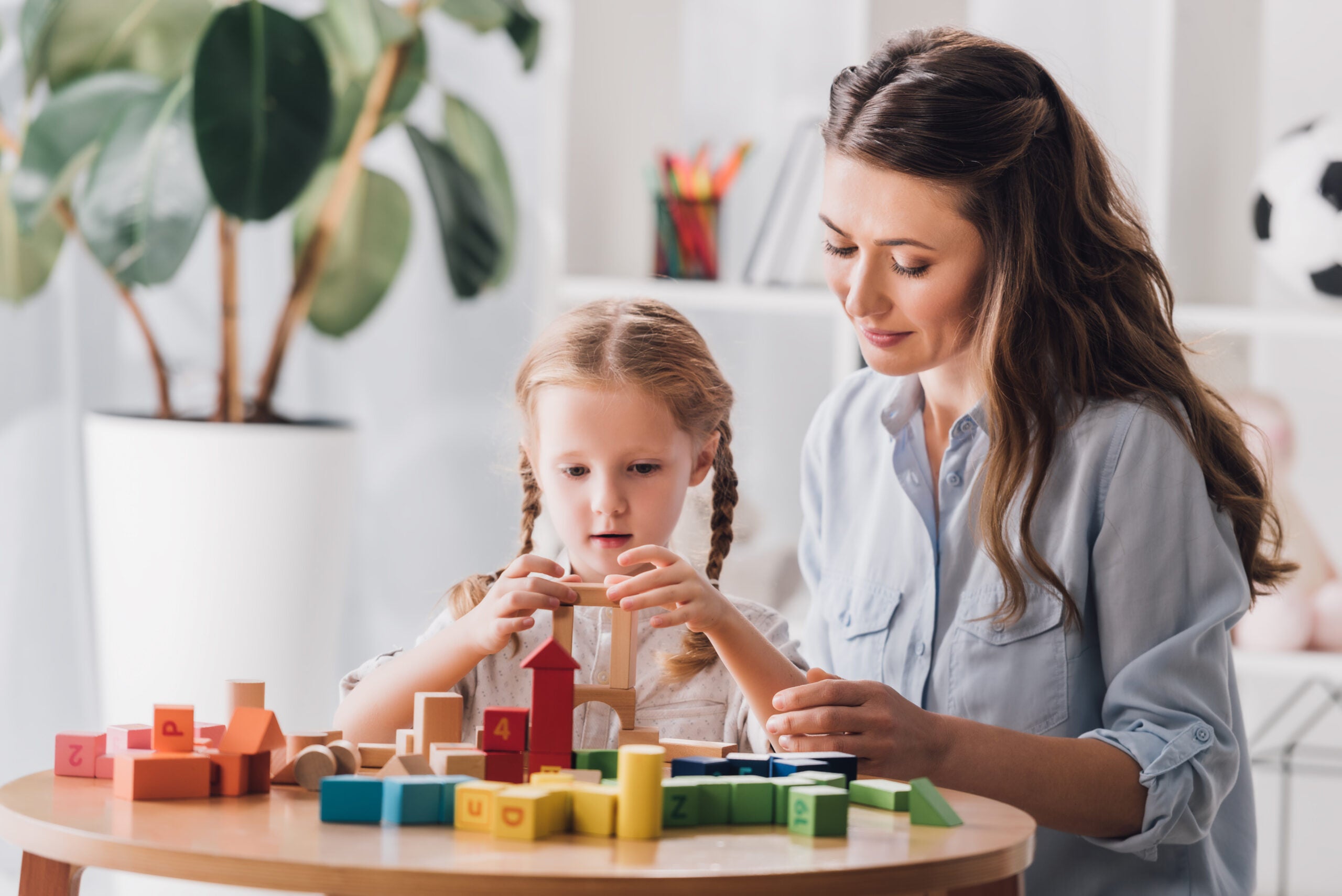 Mother daughter playing blocks